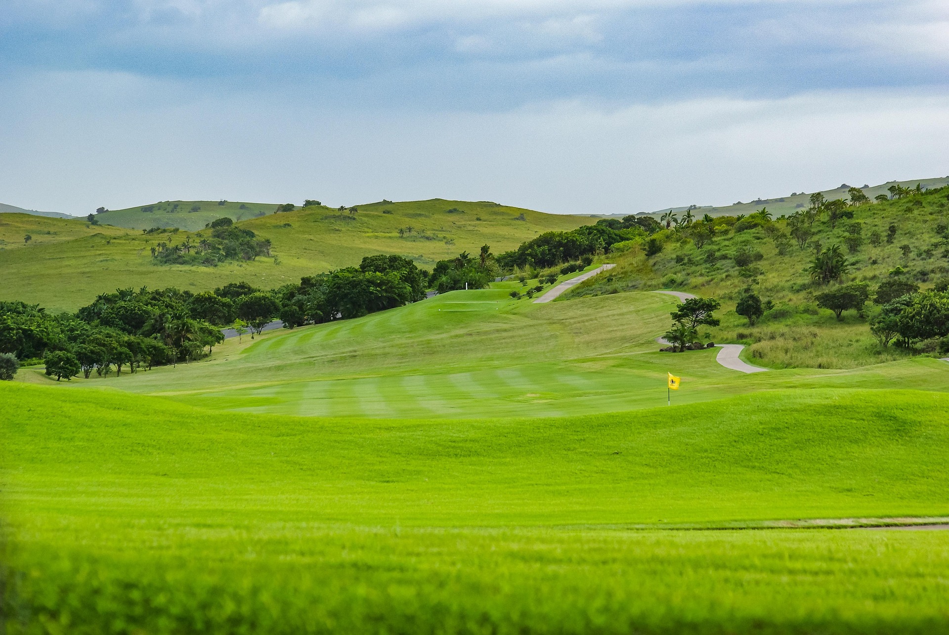Panoramic view of a lush golf course fairway